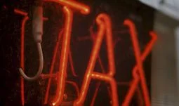 tax written in red lights 