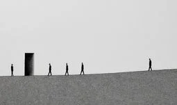bankers walking near a door 