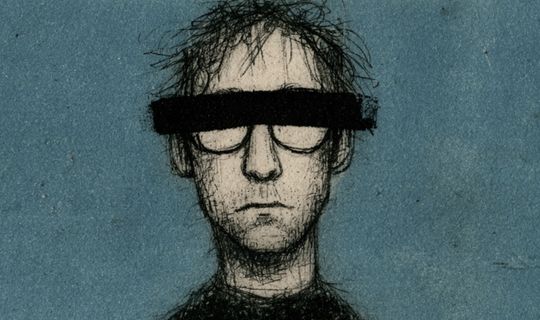 a man in glasses with a black bar of ink across his eyes