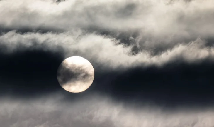 The sun behind a cloud 