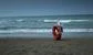 A lifebuoy on the beach.
